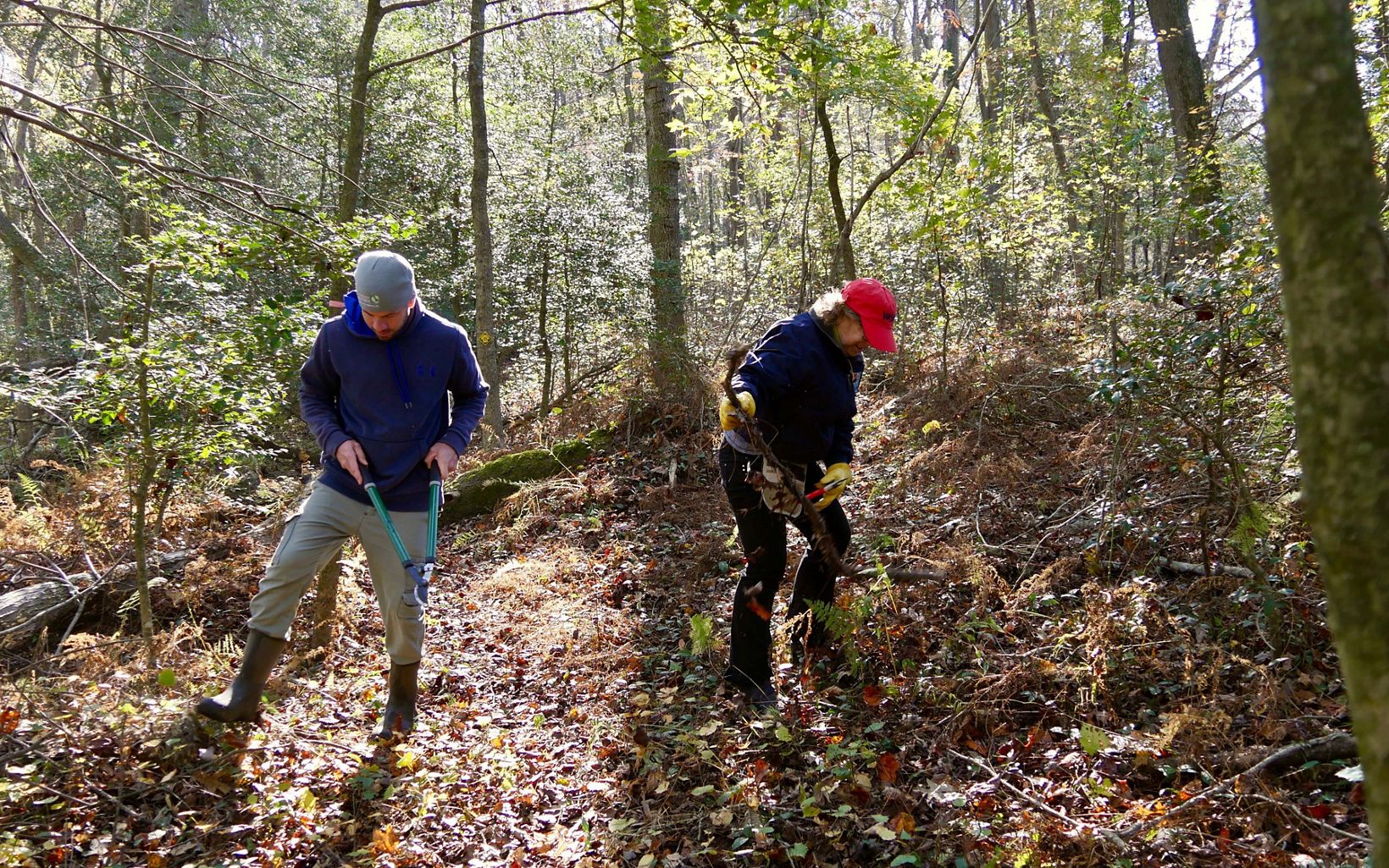 Dave Ray and Carol Pauley, members of the Nassawango Stewardship Committee, work along a section of trail during a preserve workday.