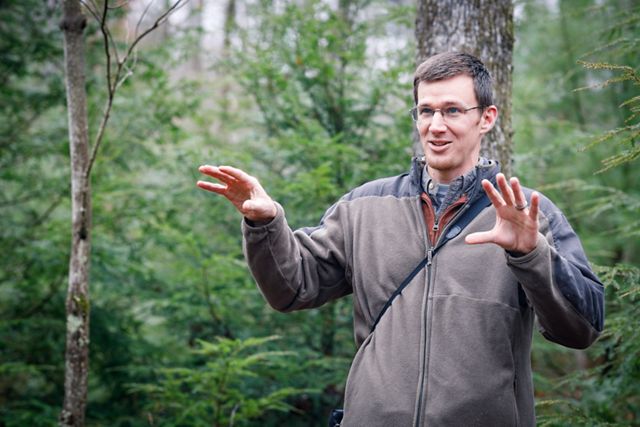 Candid photo of Conservation Forester Kevin Yoder in a forest.