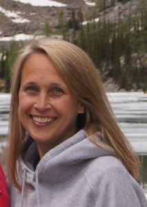 Candid photo of Development Program Manager Kristen Stevens in a forest.