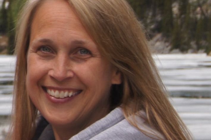 Candid photo of Development Program Manager Kristen Stevens in a forest.