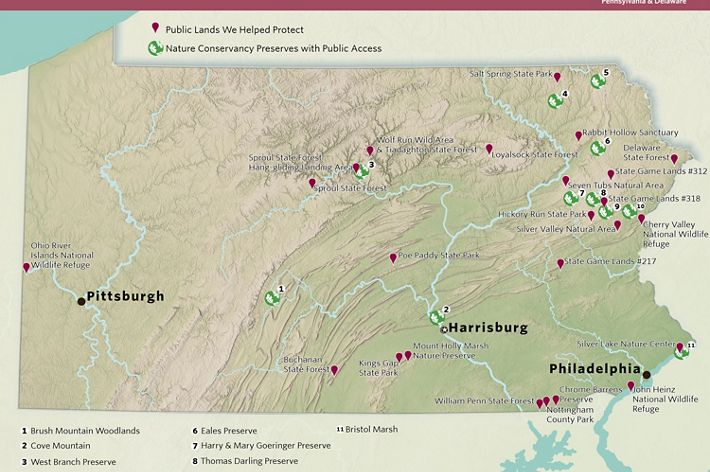 Topographic map of Pennsylvania. Red pins mark public lands TNC has helped to protect. Numbers highlight TNC preserves. Major rivers and cities are also highlighted.