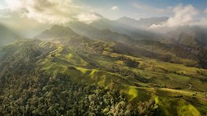 Aerial view of a green mountain area.
