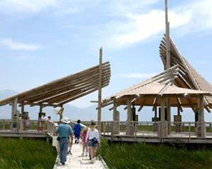 People walk down the path the Great Salt Lake pavilion.