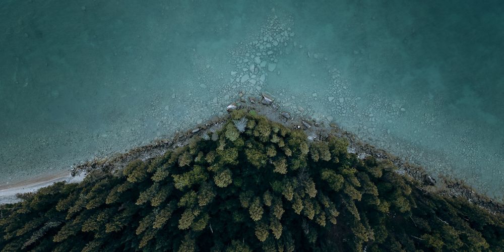Aerial view of a river winding through a lush landscape.