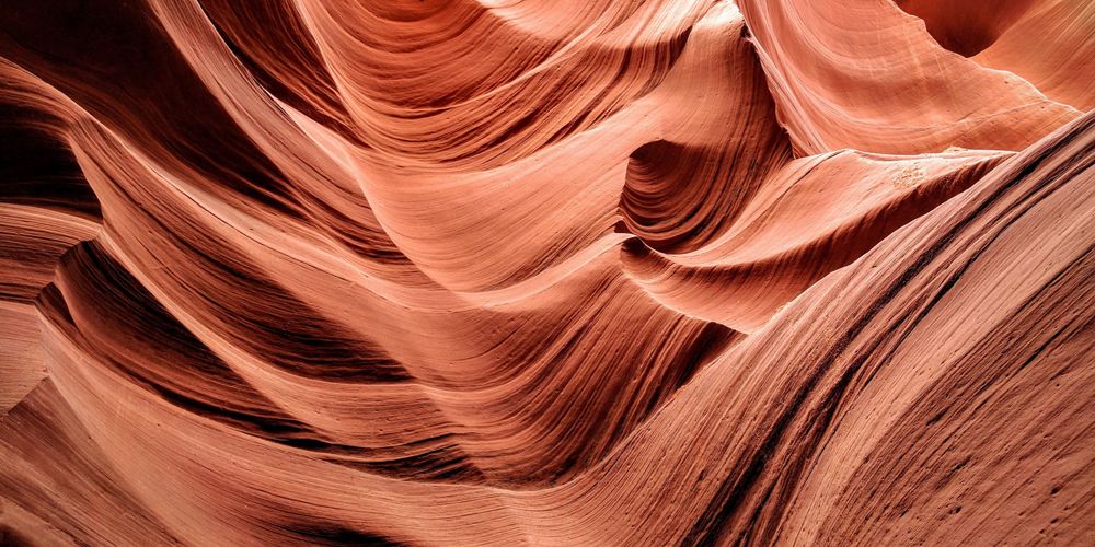 Abstract view of the red flowing rocks of a slot canyon