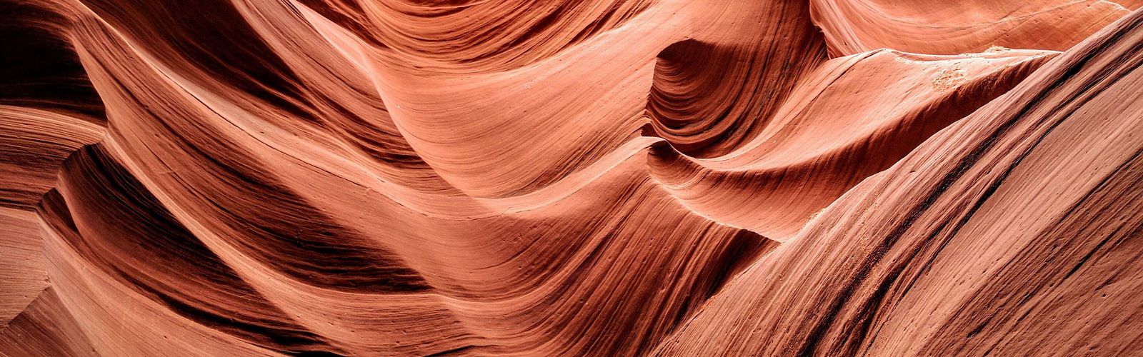 Abstract view of the red flowing rocks of a slot canyon
