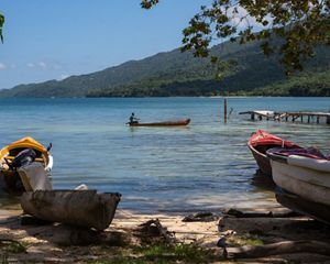 Fishing boats along a coast in Pedro Cays, Jamaica
