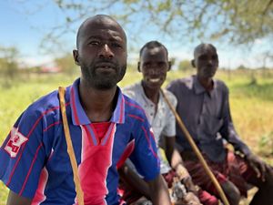 Peter Ekal sitting with friends.