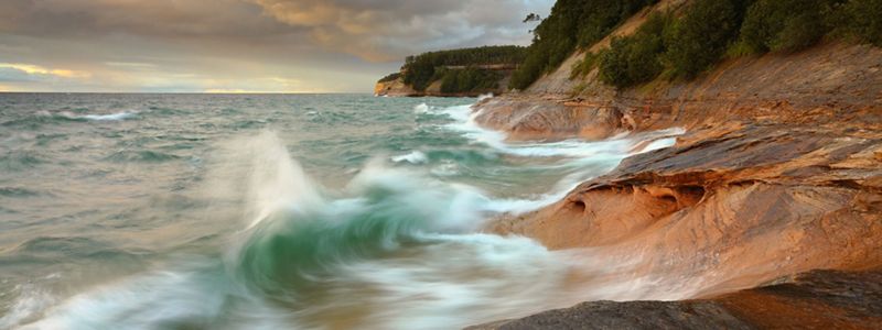 Waves crash along Pictured Rocks.