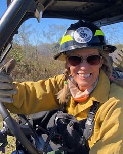TNC Preserve Manager in the field working the prescribed burn. 
