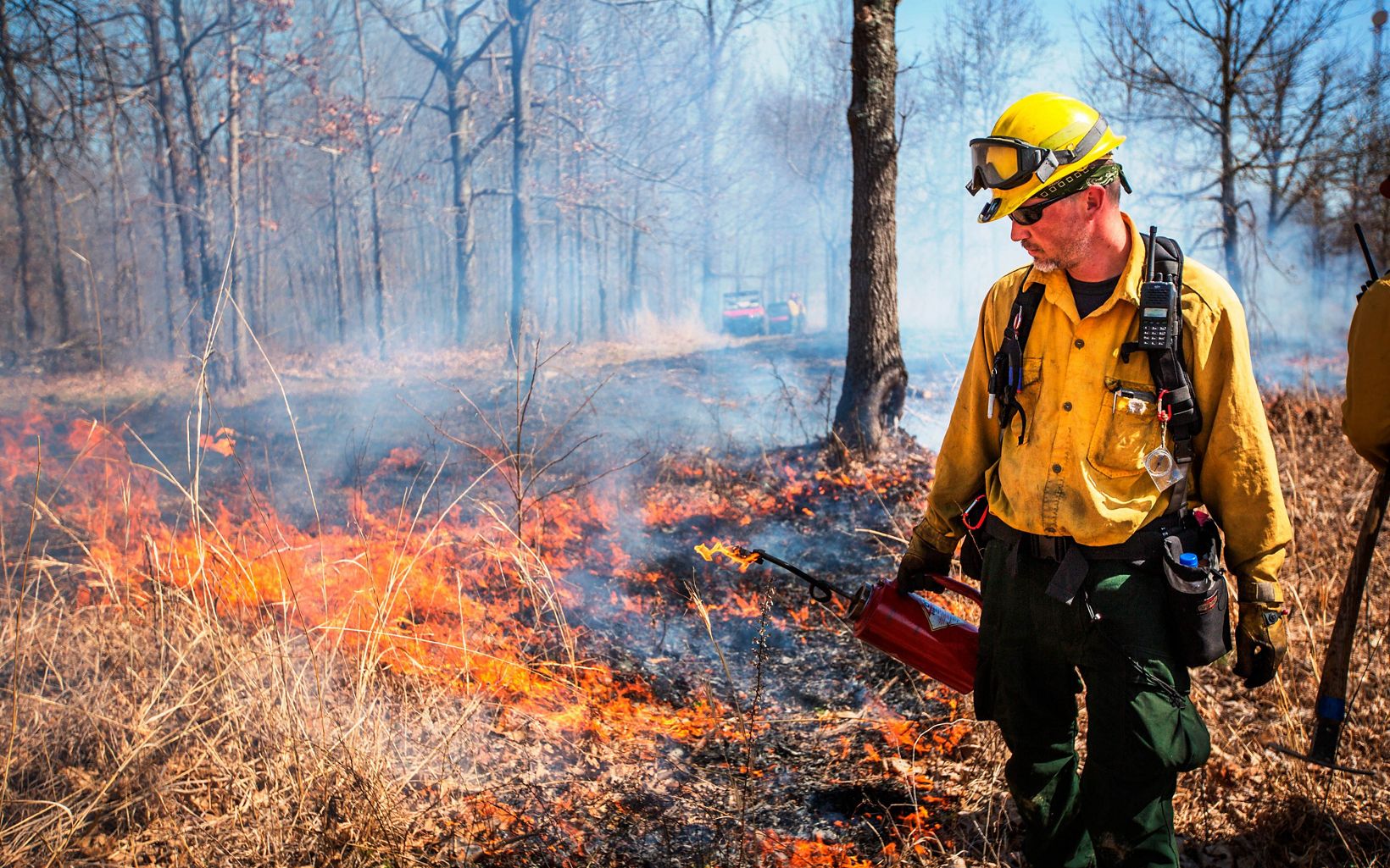 Prescribed Fire Fire personnel light a prescribed burn at a grassland preserve in Kentucky. © Mike Wilkinson