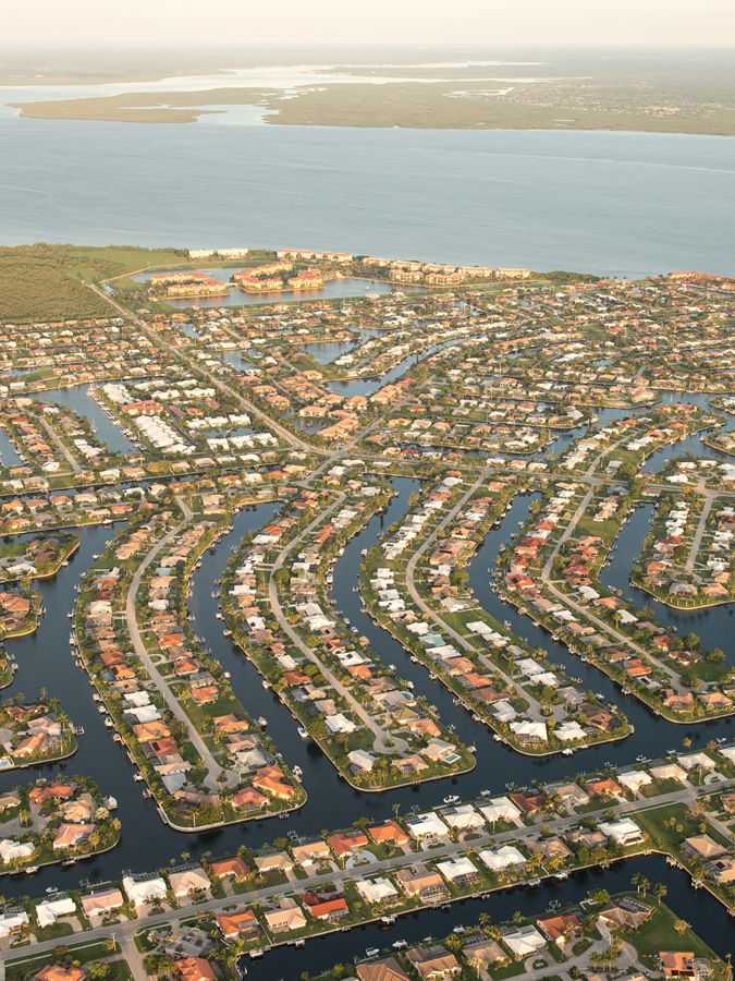 Aerial view of dense sea-side development.