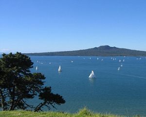 Expansive view of blue water and sailboats