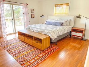 queen bed next to window.