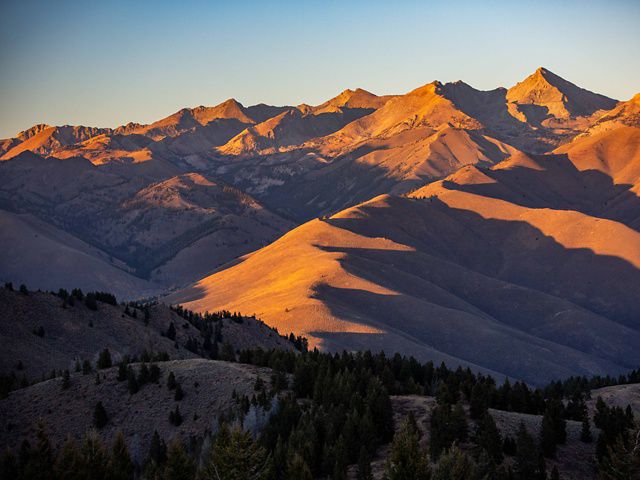 Shadows at sunset highlight the landscape of the Pioneer Mountains. Parts of this region are included in the Resilient and Connected Landscapes work. 