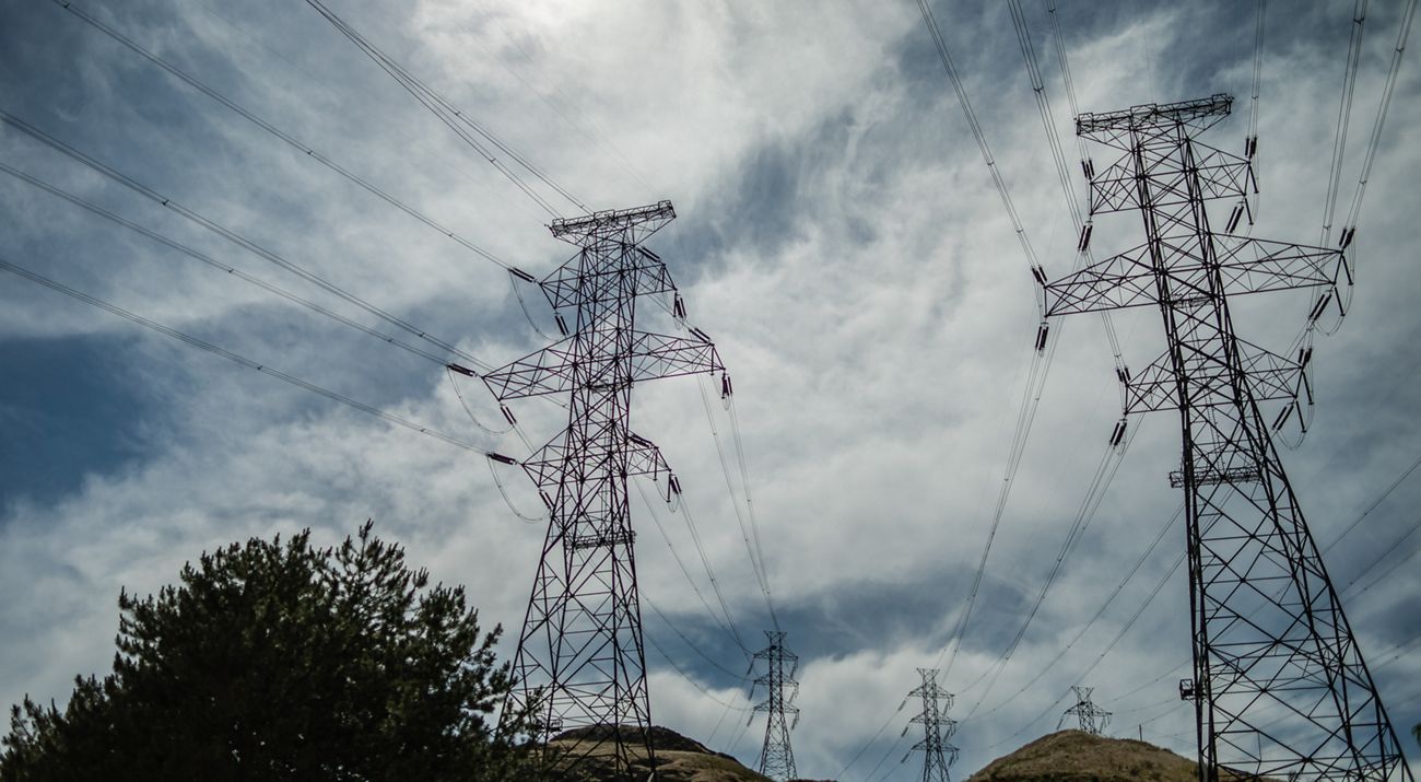 A picture of power lines on a hill
