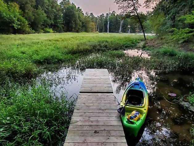 Kayak floating next to a dock