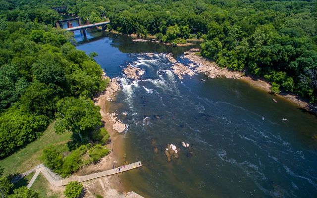 A photo of the Roanoke River and rapids, surrounded by forests.