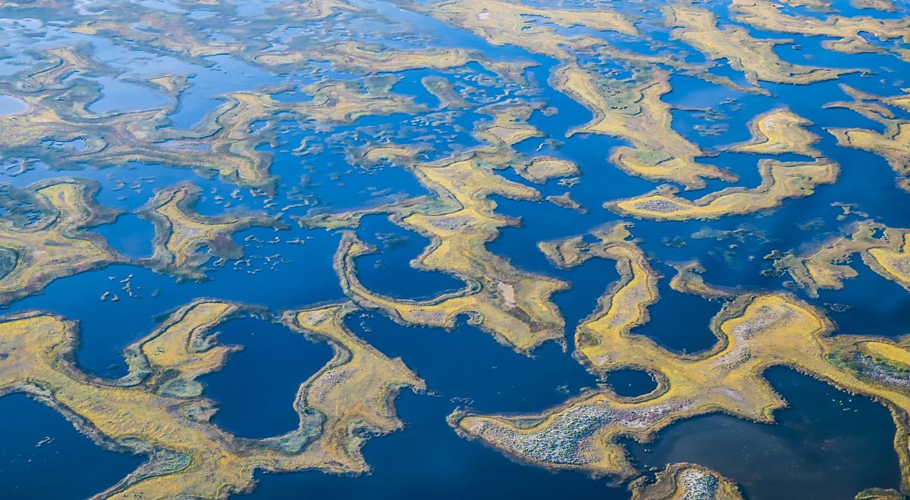 An aerial view features wetlands surrounding slivers of land.