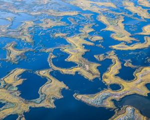 An aerial image of groundwater sitting amongst rocks.