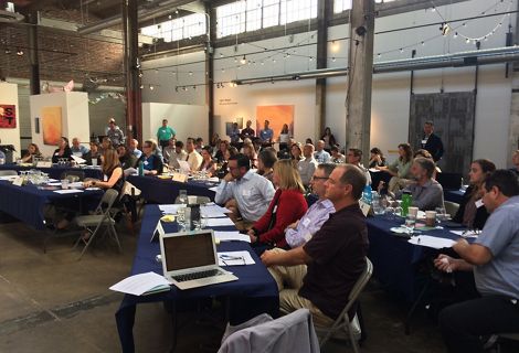 Attendees at an RCIS Symposium listening to a presentation.