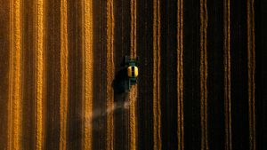Aerial view of a tractor in a field.