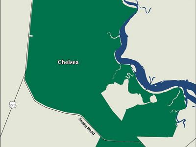 Map with green property boundaries and winding blue creek.
