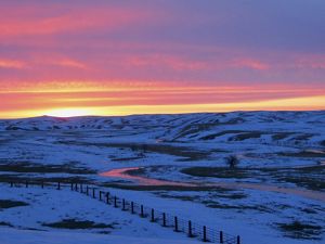 Snow on a prairie landscape.