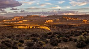 Expansive view of the red rock formations of Sheep Bridge along the Virgin River in Utah.