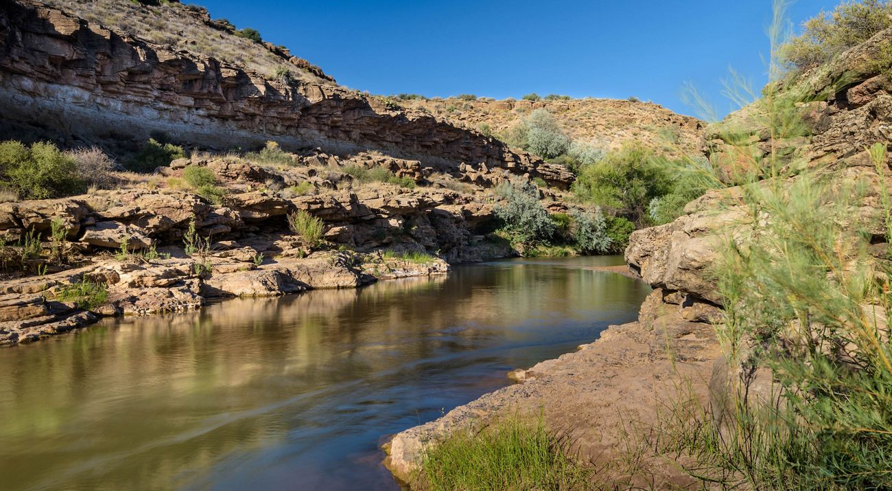 A river winds through a rocky canyon.