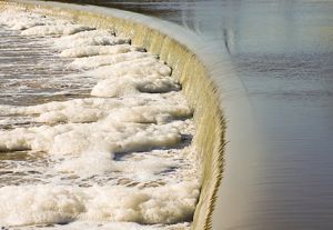 A dam obstructs flowing water.