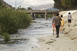 Walking along an urban river.