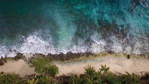Aerial view of a beach on Sikopo Island, Solomon Islands.