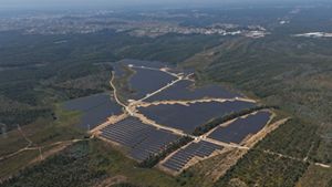 Solar farm located amongst nature, nearby a populated settlement, in Portugal.