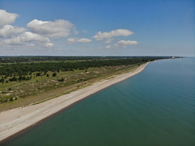 Aerial photo showing Lake Michigan shoreline, and the beach and wetlands of the Chiwaukee Prairie-Illinois Beach Lakeplain