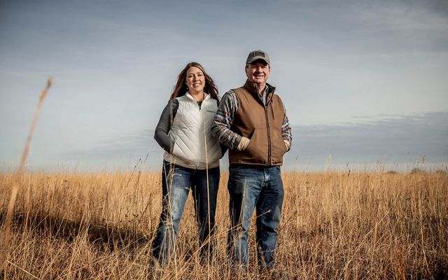 Heidi Mehl and Tod Bunting pose in a pasture.
