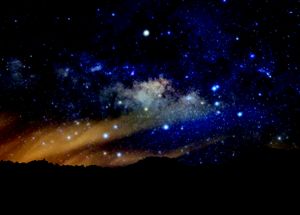 Stars shine in a night sky.