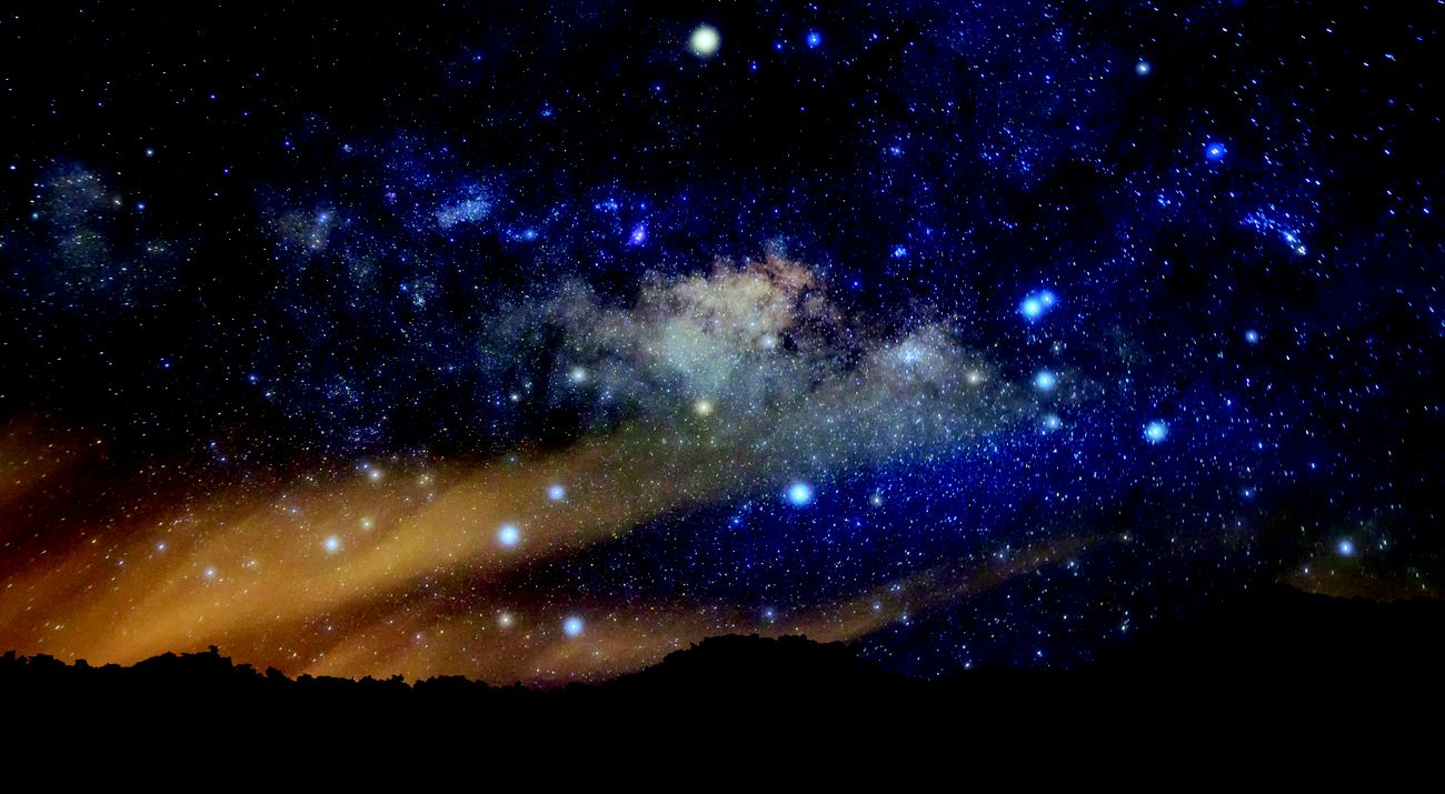 Stars shine in a night sky.