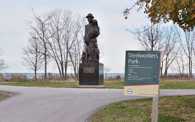 A statue sits next to a pathway at Chicago's Steelworkers Park. 