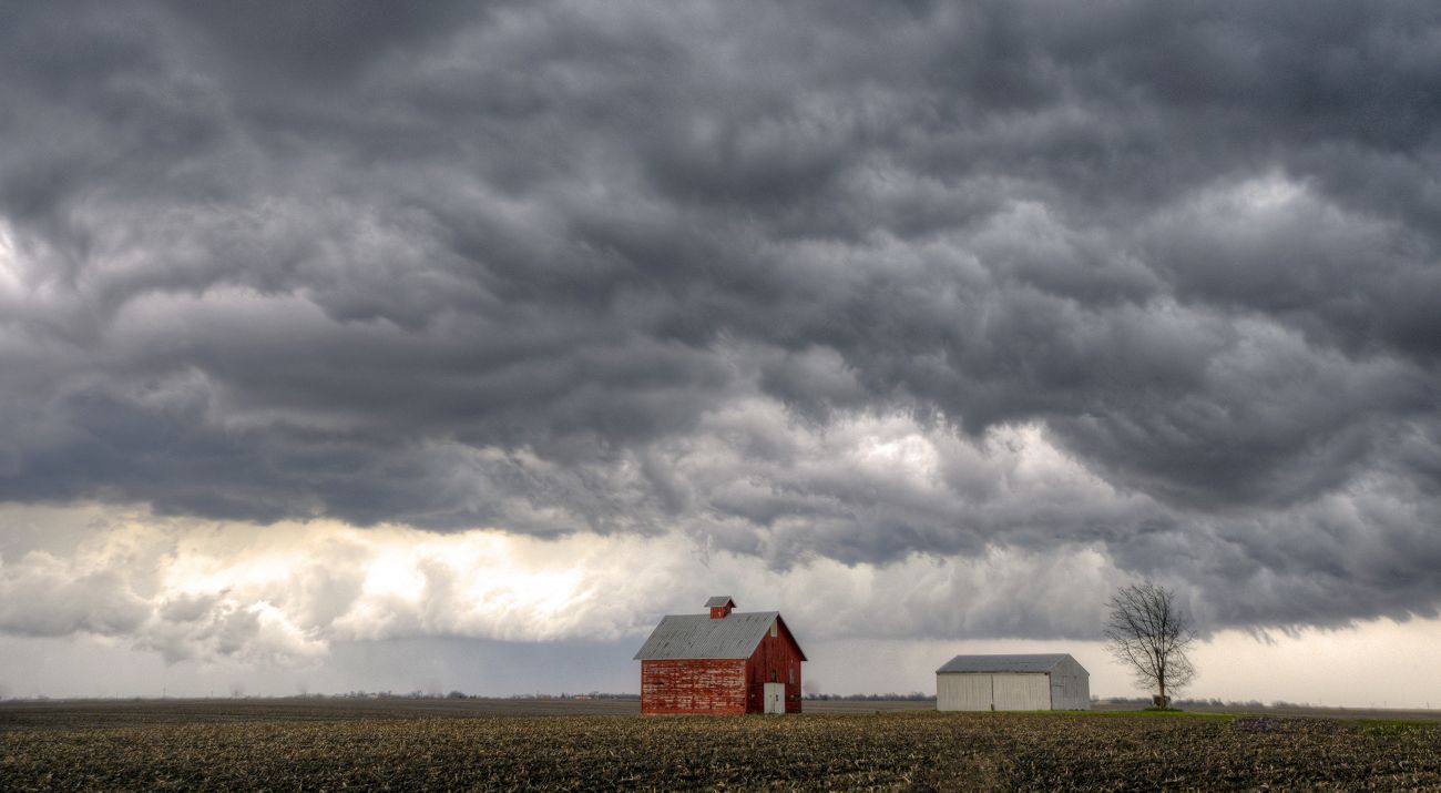 Dramatic gray clouds form on the horizon over an Illinois farm.
