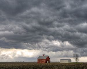 Dramatic gray clouds form on the horizon over an Illinois farm.