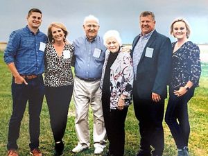 Six members of the Strasburger family in a field.