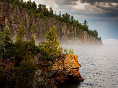 Forested cliffs along the Lake Superior shore.