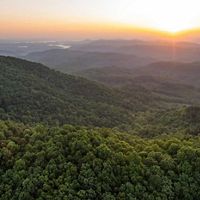 Sunrise aerial image taken near the border of Tennessee and Kentucky of land protected by The Nature Conservancy's Cumberland Forest Project.