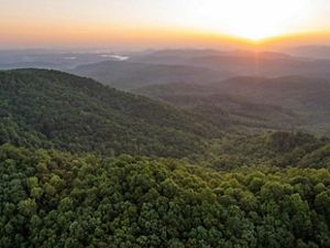 Sunrise aerial image taken near the border of Tennessee and Kentucky of land protected by The Nature Conservancy's Cumberland Forest Project.