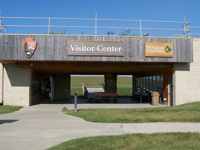 Visitors Center sign on building