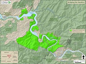 Graphic of a map highlights lands protected around a river corridor and near a national park.
