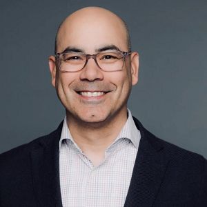 Headshot of person smiling.