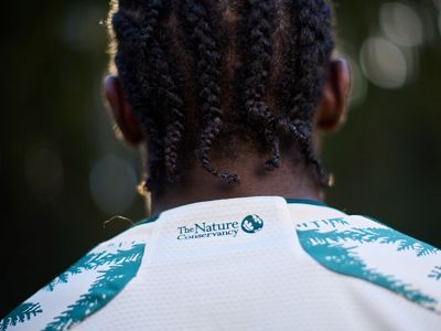 The Portland Timbers unveil their new community fit featuring The Nature Conservancy's logo.