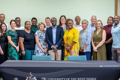A group of TNC staff, BESF members, and Barbados' civil servants stand together in Barbados.